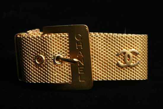 Appraisal: CHANEL GOLD-TONE MESH BRACELET Signed Belt-form with three applied Chanel