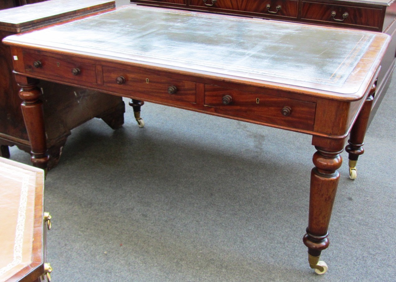 Appraisal: A Victorian mahogany centre library table the tooled leather top