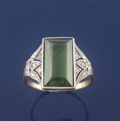 Appraisal: An Edwardian tourmaline and diamond ring baguette shaped tourmaline is