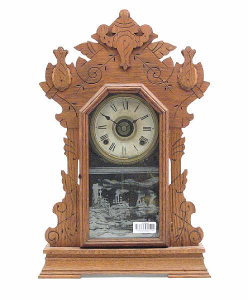 Appraisal: An American walnut mantel clock by Seth Thomas with etched