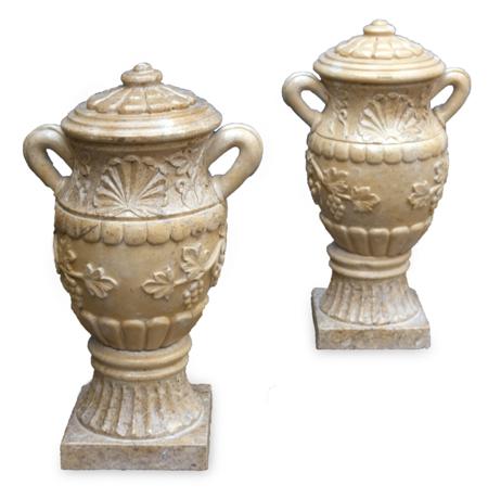 Appraisal: A pair of modern beige coloured marble urns and columns