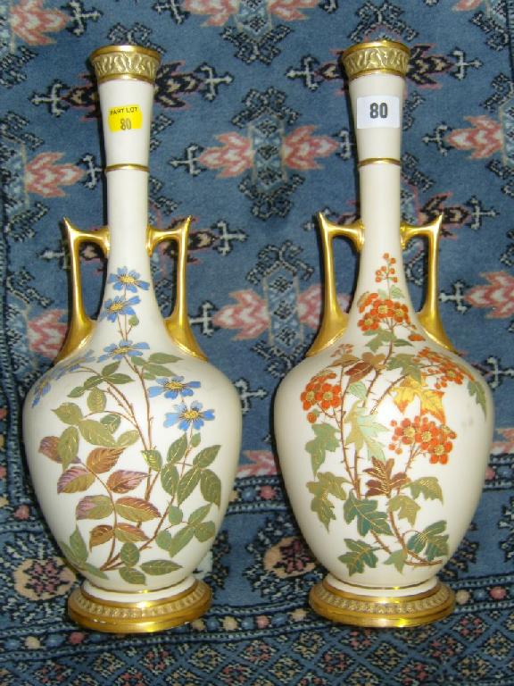 Appraisal: A pair of Royal Worcester tall -handled vases with drawn