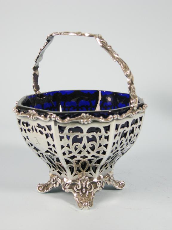 Appraisal: A Victorian pierced octagonal Sugar Basket with swing handle and