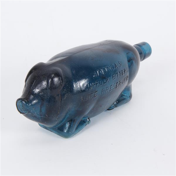 Appraisal: America's Suffolk Bitters Life Preserver pig form blue advertising bottle