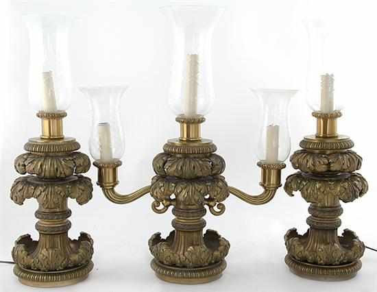 Appraisal: Extravagant three-piece bronze light fixture set circa possibly American consisting