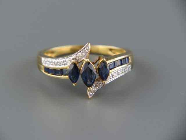 Appraisal: Sapphire Diamond Ring rich blue marquise gems with diamonds on