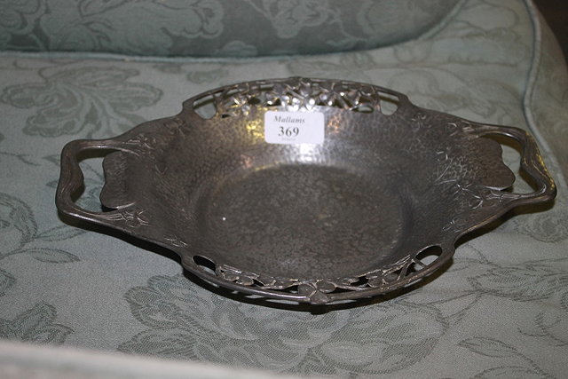 Appraisal: A TUDRIC HAMMERED PEWTER DISH of shaped form with pierced