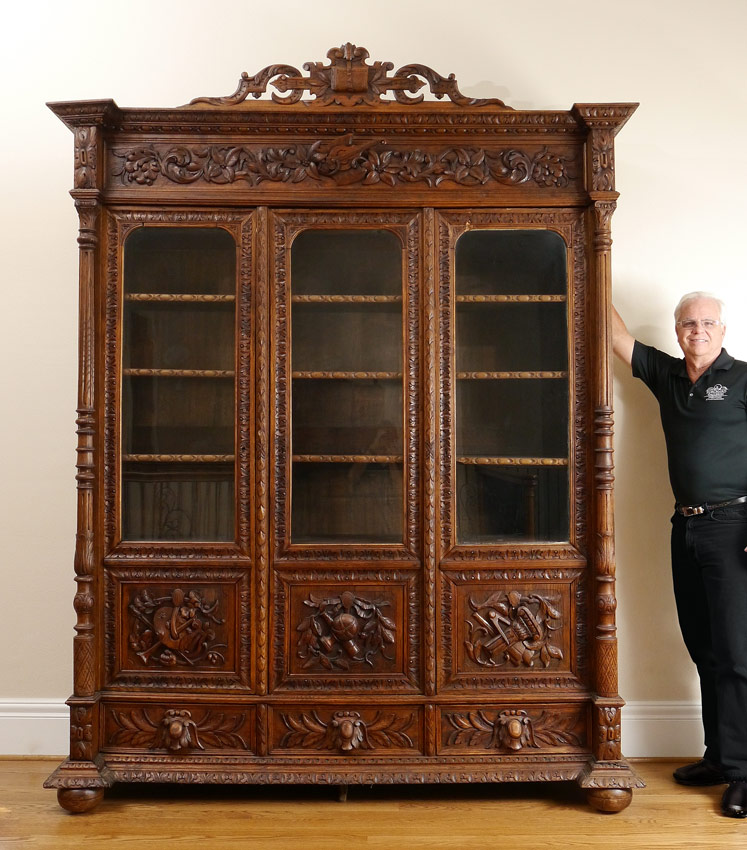 Appraisal: PROFUSELY CARVED OAK RENAISSANCE REVIVAL BOOKCASE Carved and applied decoration