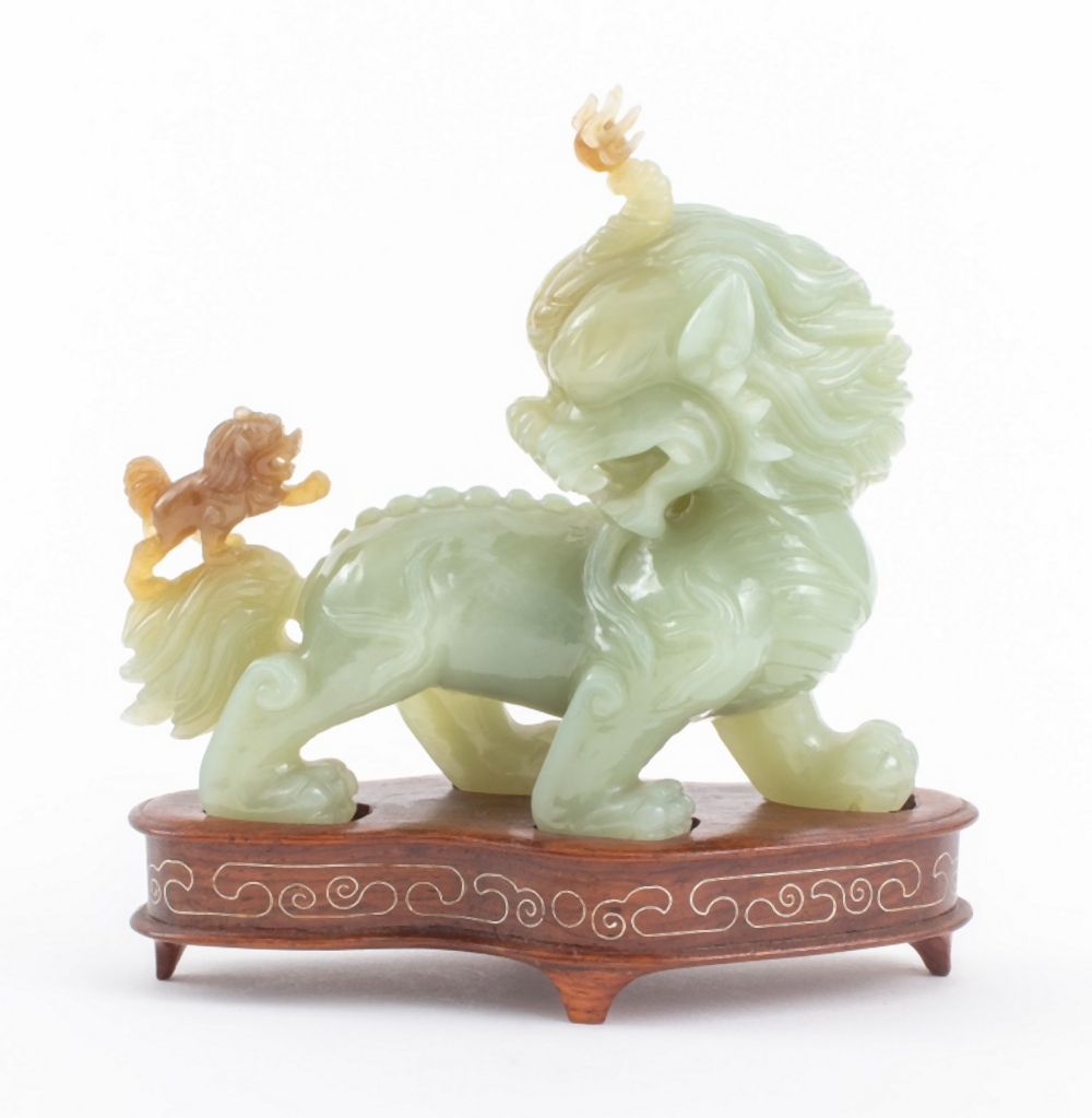 Appraisal: CHINESE JADE CARVING OF A FOO LION Chinese jade carving