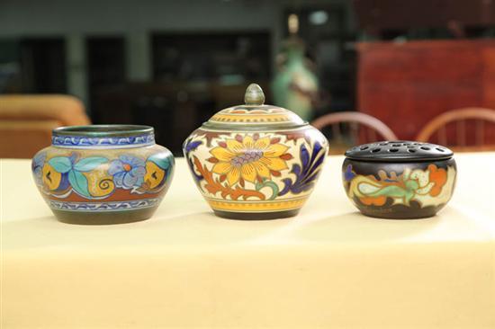 Appraisal: THREE GOUDA POTTERY BOWLS All with polychrome floral adornment A