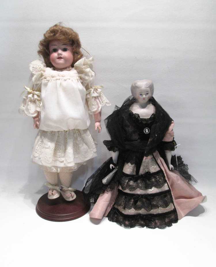 Appraisal: TWO BISQUE HEAD DOLLS the first a German Armand Marseille