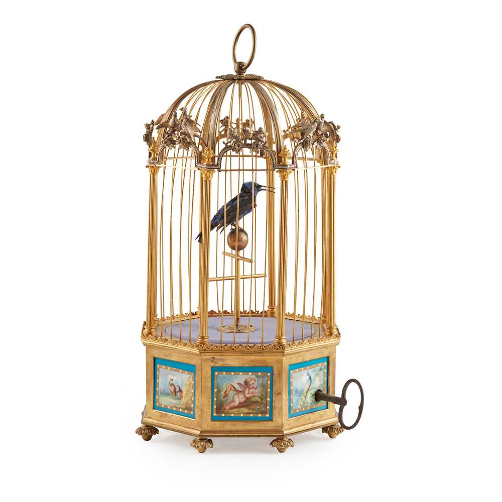 Appraisal: FRENCH PORCELAIN MOUNTED GILT AND SILVERED BRASS BIRDCAGE AND SINGING