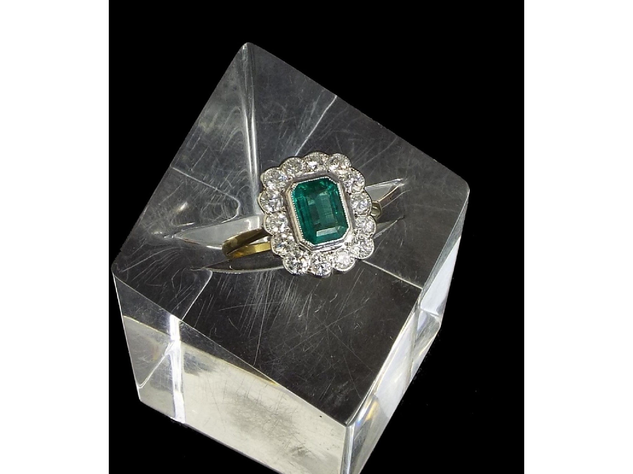 Appraisal: ct emerald and diamond rectangular cluster ring the central emerald