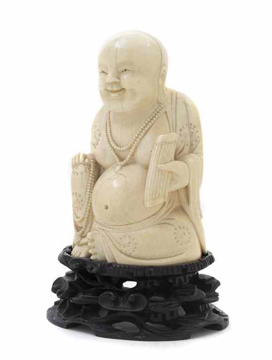 Appraisal: A Chinese Carved Ivory Figure of a Happy Seated Buddha