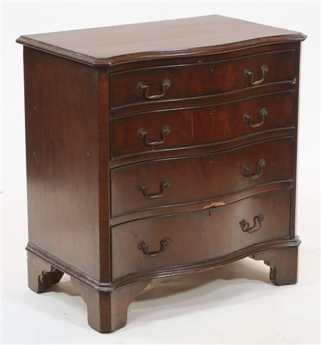 Appraisal: A George III style mahogany serpentine chest the moulded top