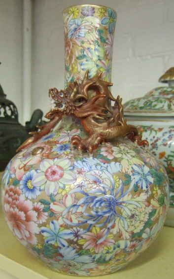 Appraisal: A Chinese 'millefleurs' bottle vase decorated with scattered flowerheads on