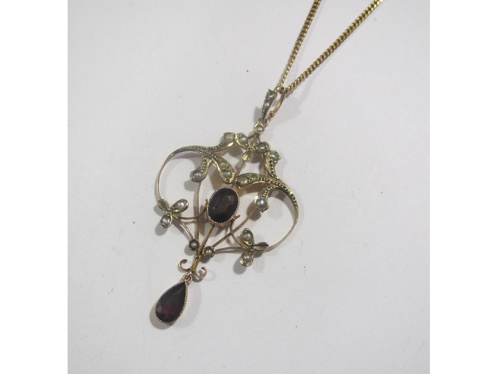 Appraisal: Edwardian ct gold garnet and seed pearl set pendant on