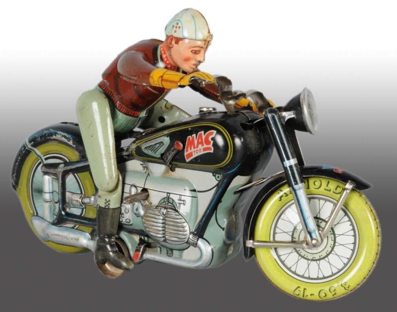 Appraisal: Tin Arnold MAC The Motorcyclist Wind-Up Toy Description German Working