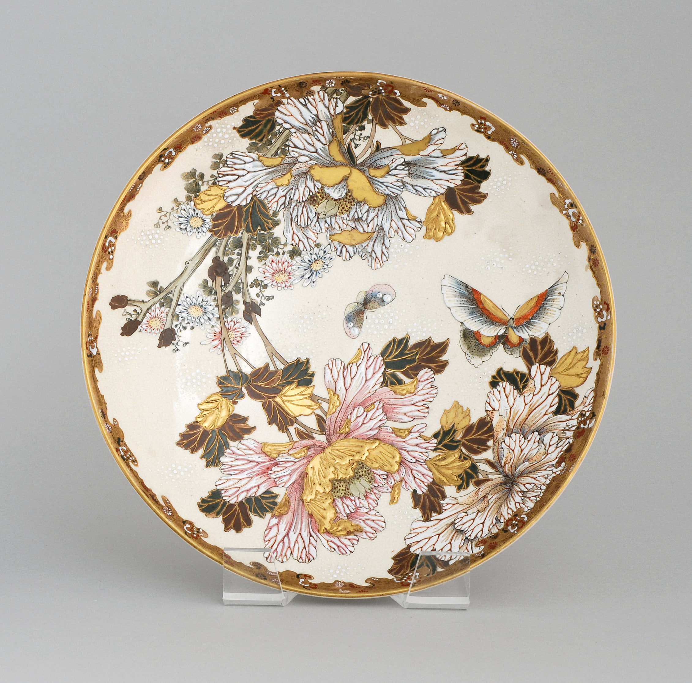 Appraisal: SATSUMA POTTERY CHARGER With peony and butterfly decoration Diameter cm