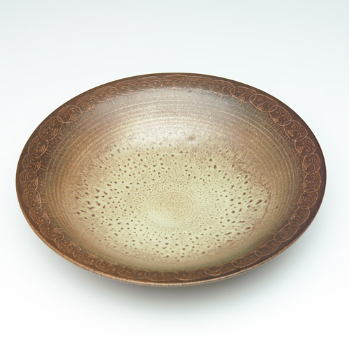 Appraisal: SCHEIER Early flaring bowl with a band of etched faces