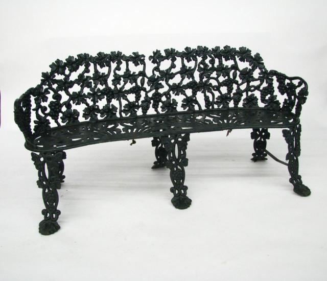 Appraisal: Black painted cast iron garden bench in grape and leaf