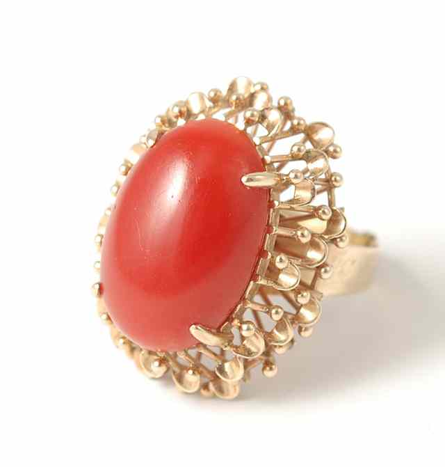 Appraisal: RED CORAL AND TEN KARAT GOLD RING secured by four