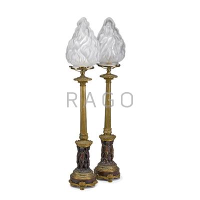 Appraisal: PAIR OF BRONZE AND MARBLE TABLE LAMPS Cupid and dolphin