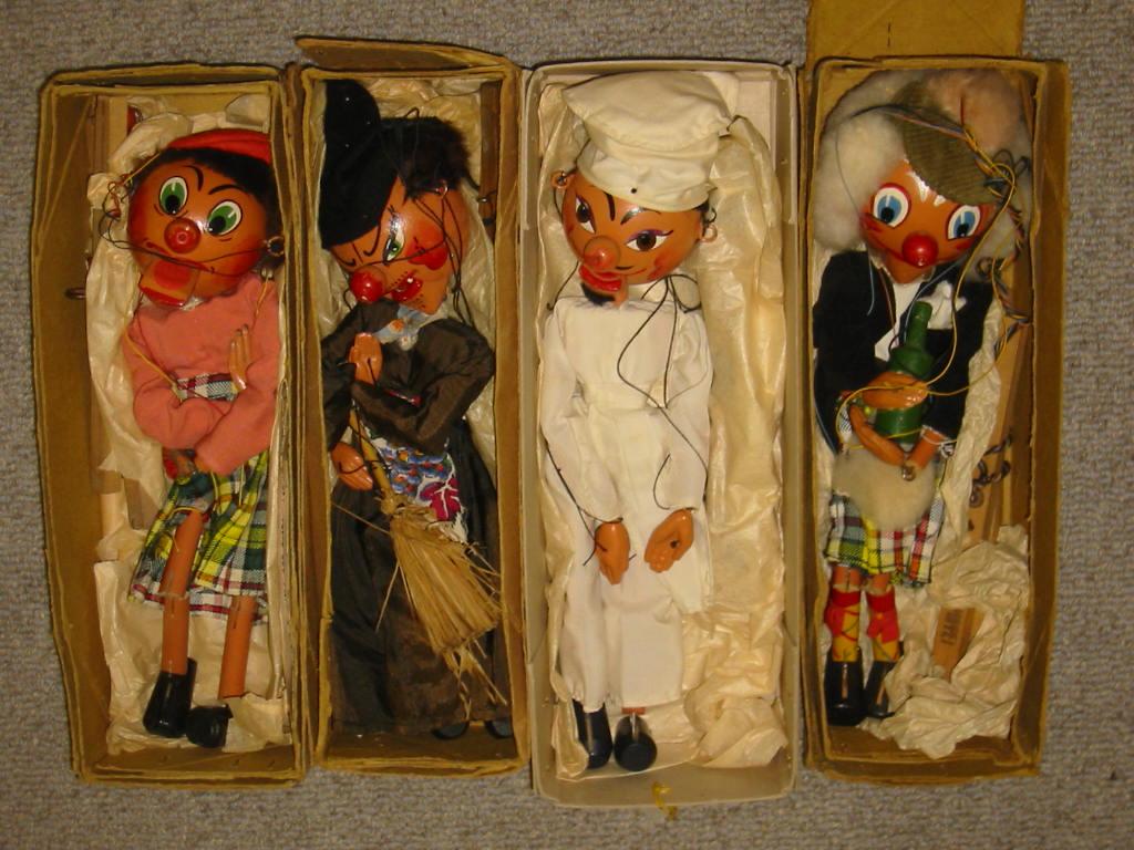 Appraisal: Four Pelham puppets Mrs MacBoozle painted lead hands brown box