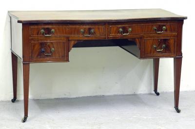 Appraisal: AN EDWARDIAN MAHOGANY DRESSING TABLE of serpentine oblong form moulded