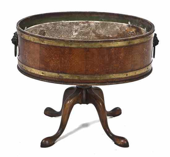 Appraisal: A Georgian Style Brass Banded Wine Cooler of oval form