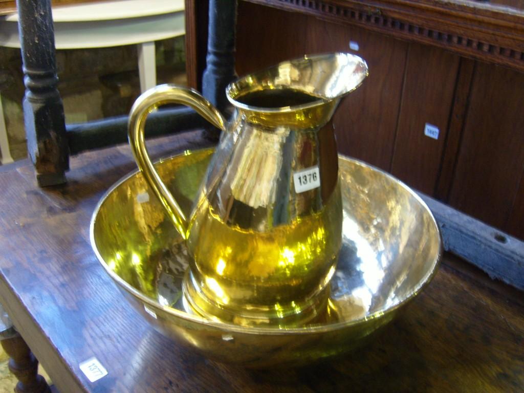 Appraisal: A Victorian polished brass jug and basin set of baluster