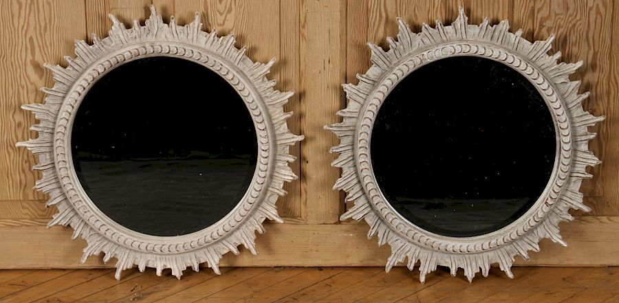 Appraisal: PAIR CARVED SUNBURST BEVELED GLASS MIRRORS A pair of carved