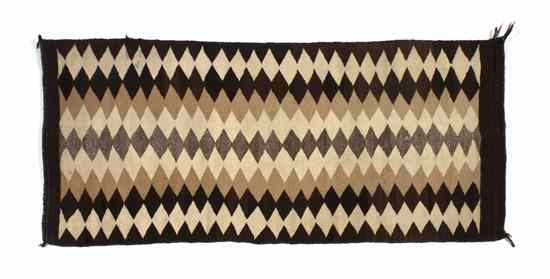 Appraisal: A Navajo Rug with vertically stacked diamond design in black