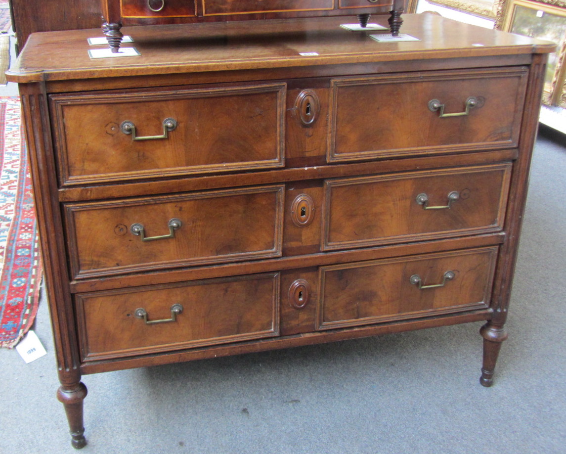 Appraisal: An early th century French walnut three drawer commode with