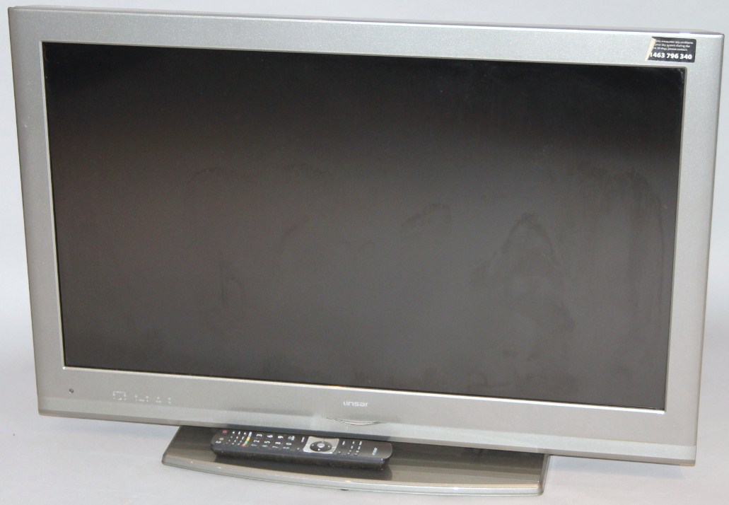 Appraisal: An Unsar colour television in silver trim with remote control