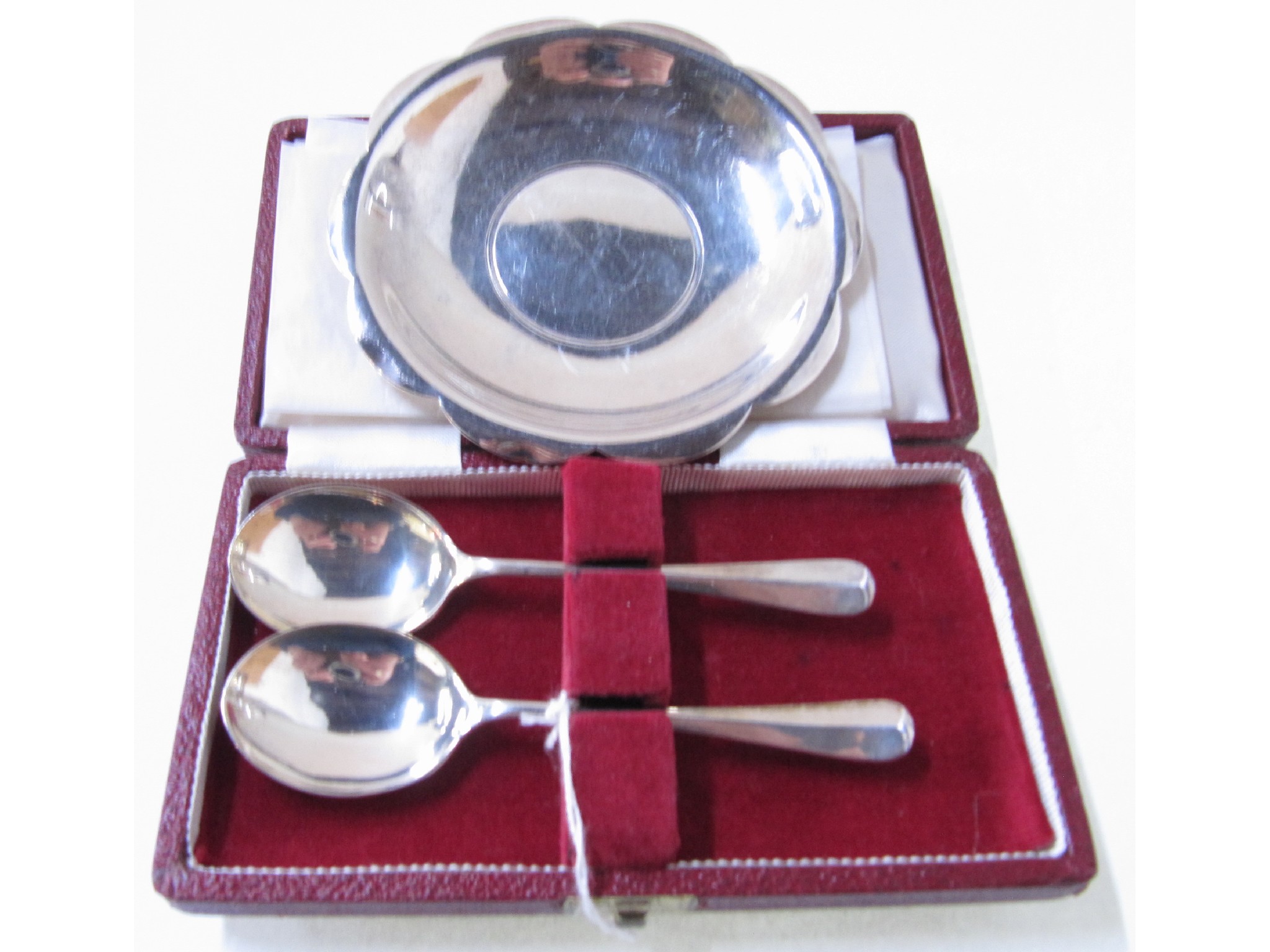 Appraisal: A lot comprising a cased pair of silver spoons and