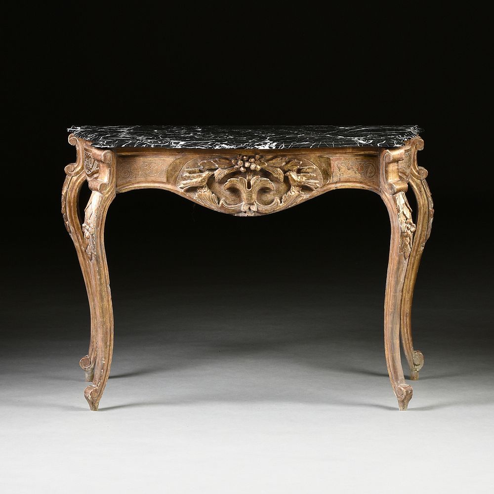 Appraisal: AN ITALIAN ROCOCO STYLE MARBLE TOPPED AND PARCEL GILT CARVED