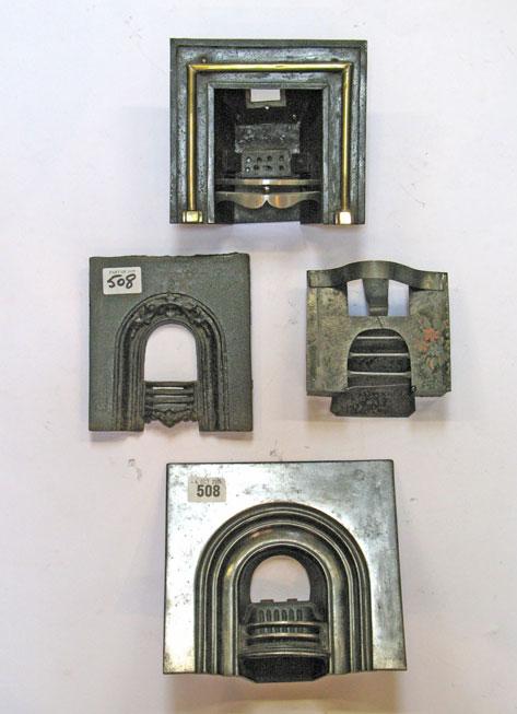 Appraisal: FOUR MINIATURE FIREPLACES one cast steel example carrying registration marks