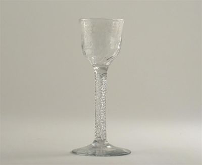 Appraisal: A wine glass the moulded bowl engraved with vine leaves