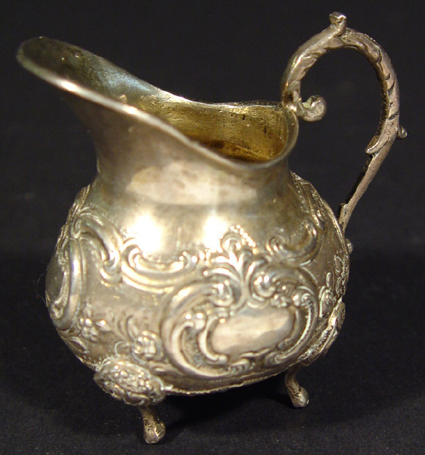 Appraisal: German sterling silver cream jug embossed with flowers cm high