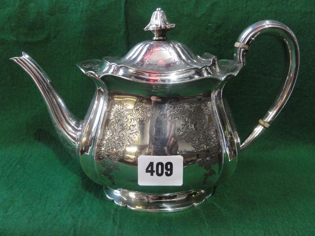 Appraisal: A late Victorian silver teapot with floral engraved panels Sheffield