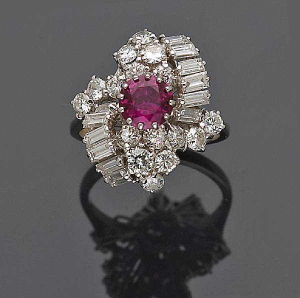 Appraisal: A ruby and diamond cluster ring estimated total diamond weight