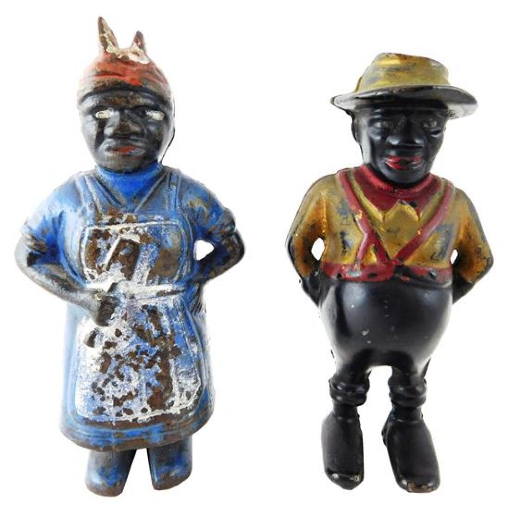 Appraisal: BLACK AMERICANA Pair of still cast iron banks c African