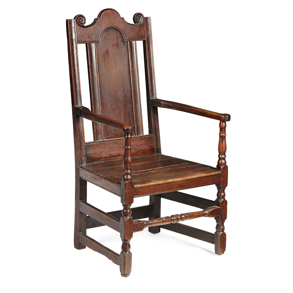 Appraisal: A SCOTTISH CARVED OAK ARMCHAIR TH CENTURY the panelled back