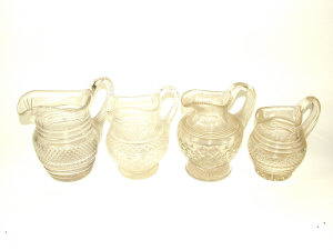 Appraisal: Four Regency and later cut glass water jugs with cut