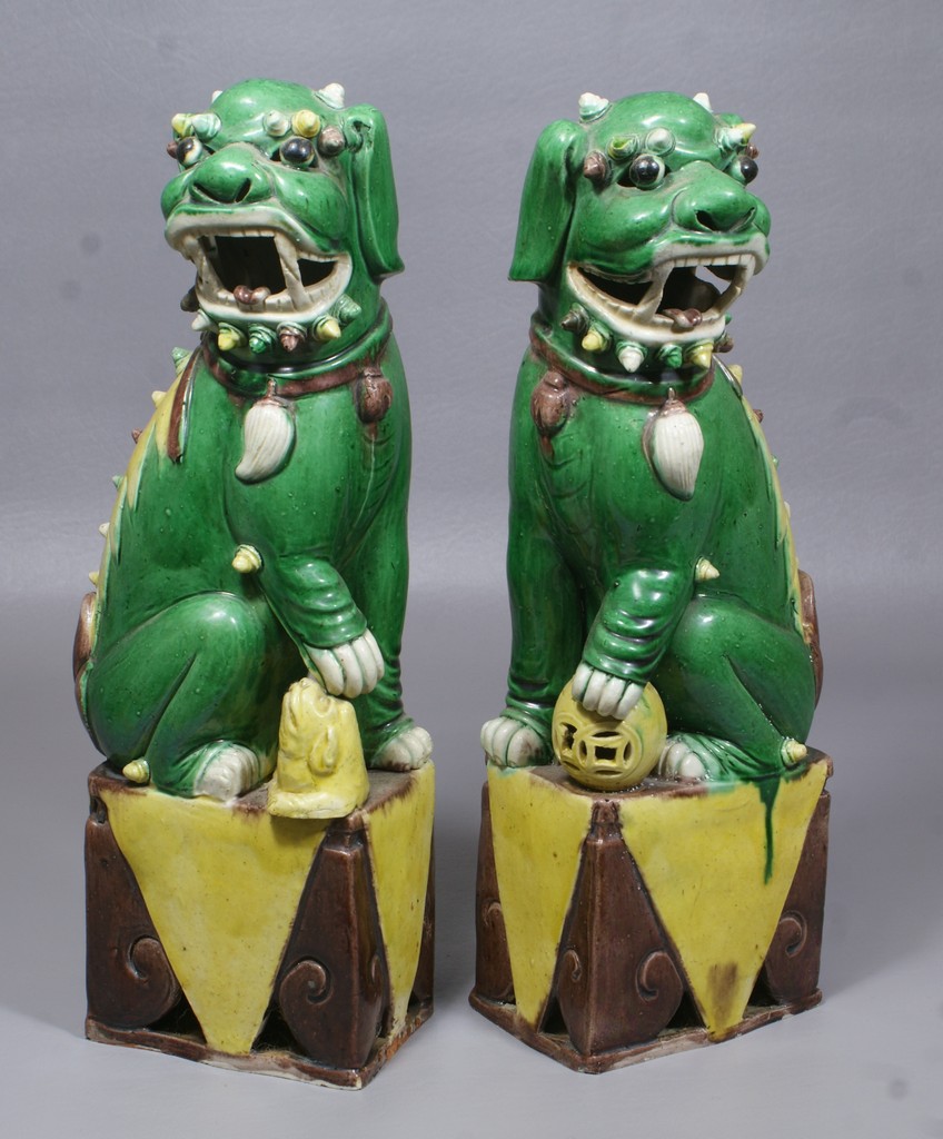 Appraisal: Pr early Republic Chinese pottery foo dogs on square pedestals