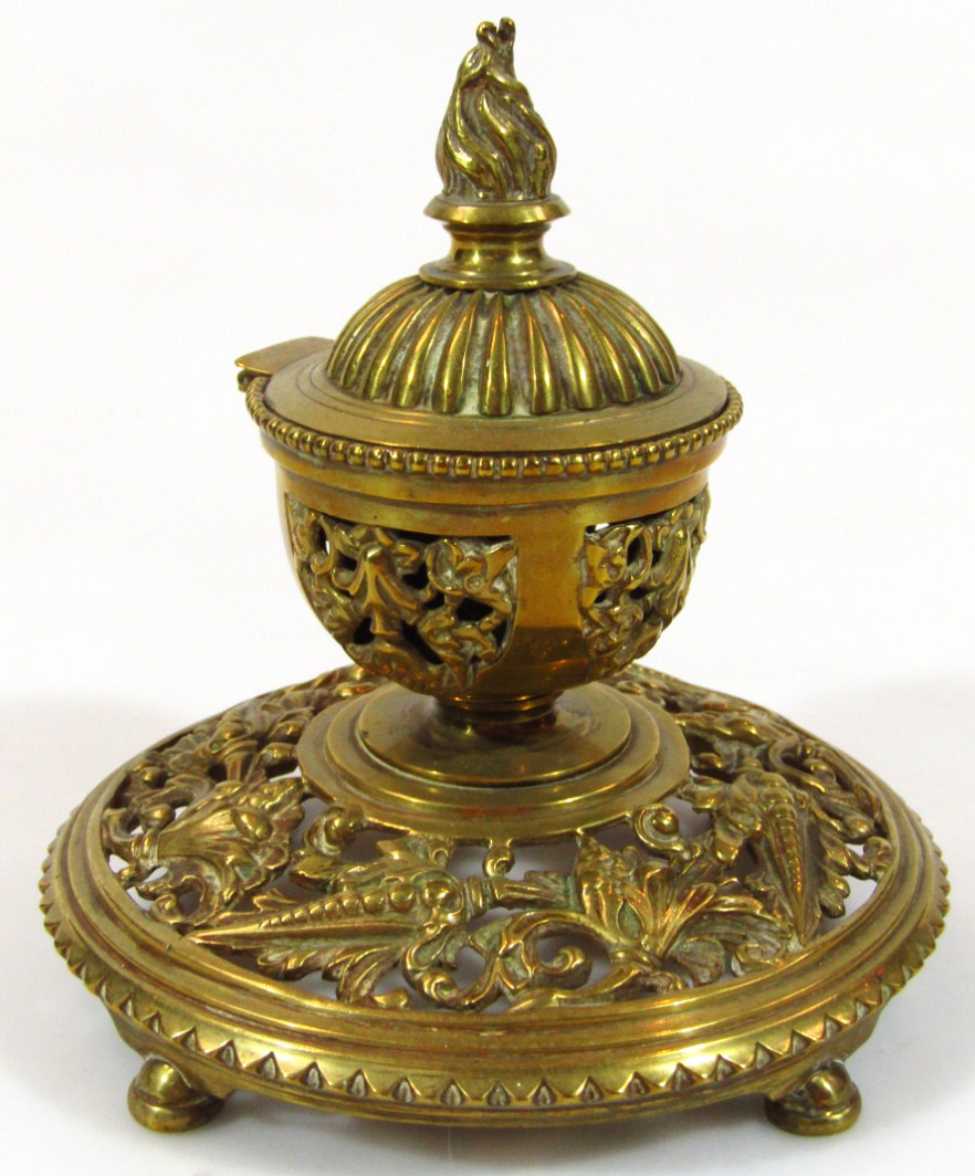 Appraisal: A thC brass inkwell centred by a hinged bowl with