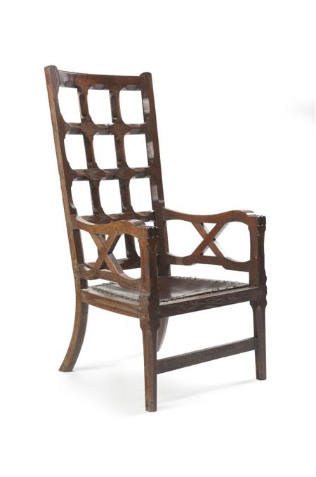 Appraisal: COTSWOLD SCHOOL ARMCHAIR CIRCA oak with chamfered lattice back above