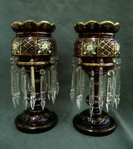 Appraisal: Pair of cranberry glass lustres enamel decorated with crystal prisms