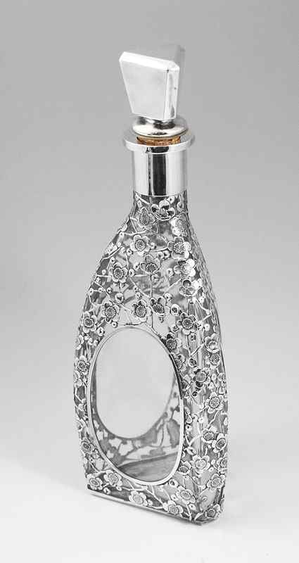 Appraisal: SILVER OVERLAY DECANTER Heavy silver overlay in a floral motif